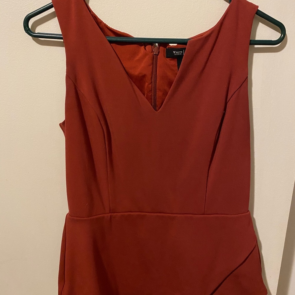 Business casual sleeveless blouse, rust color.